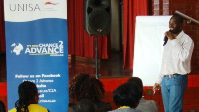 Facilitator Joseph Chisasa from the Department of Finance, Risk Management & Banking at the Phoenix programme presenting on Budgeting and how to be free from debt